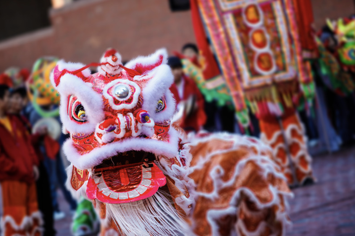 Parade goers ring in the Year of the Snake with a traditional lion dance performance.
